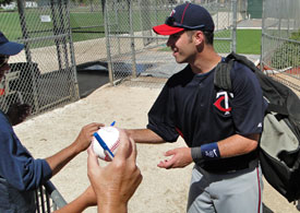 Joe Mauer autographing following a practice in Fort Myers