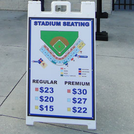 A sign outside of the Blue Jays' stadium in Dunedin lists prices by game classification