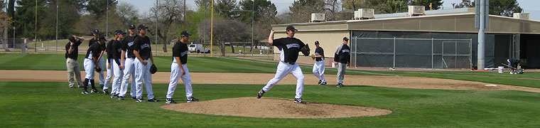 Rockies pitchers practice on a back field in Tucson